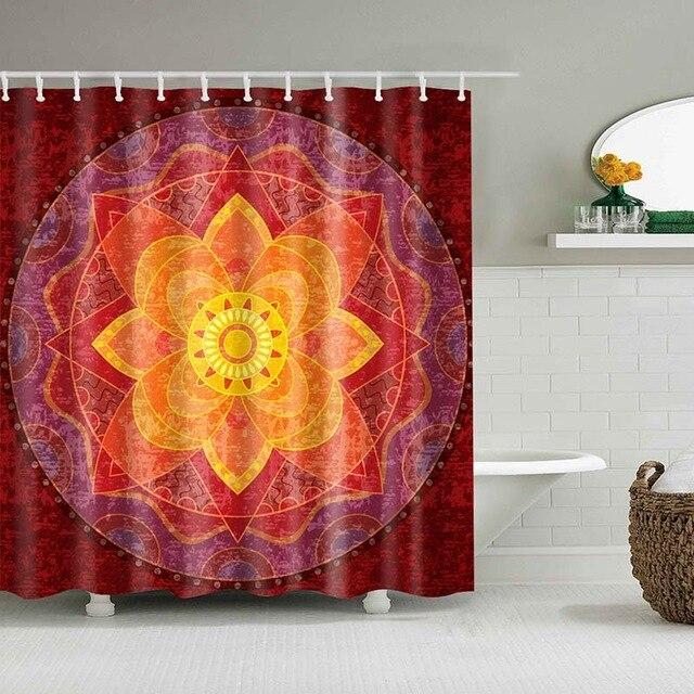 Large floral mandala with red orange and yellow petals on textured garnet red