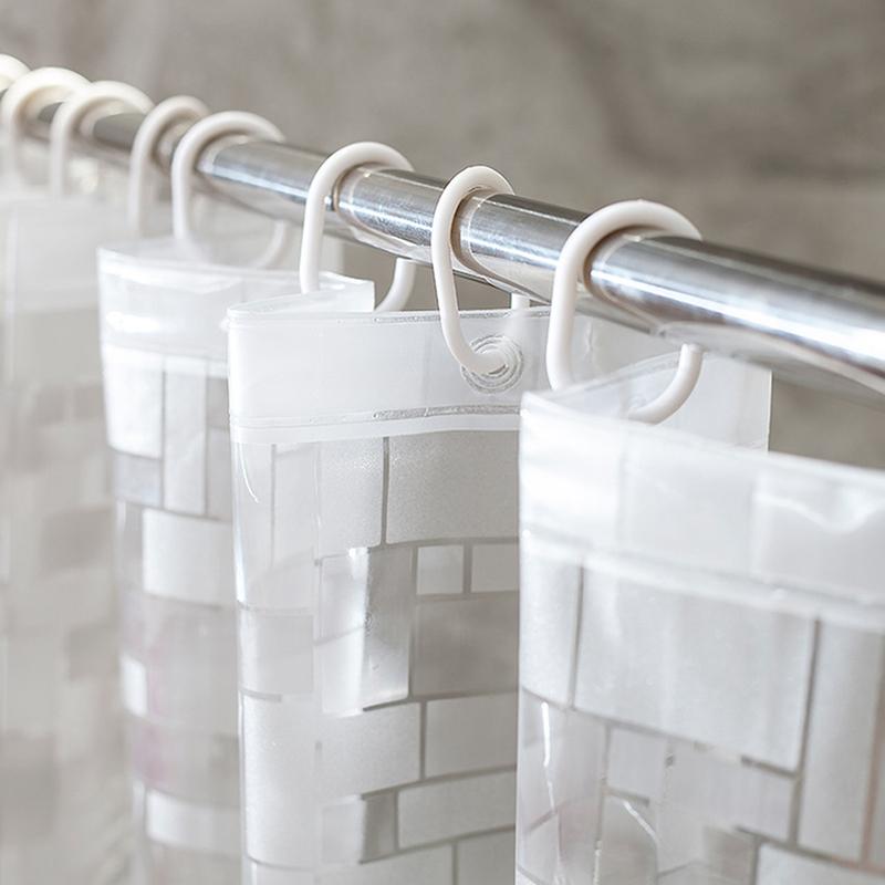 Close view of the silver square relief on clear plastic