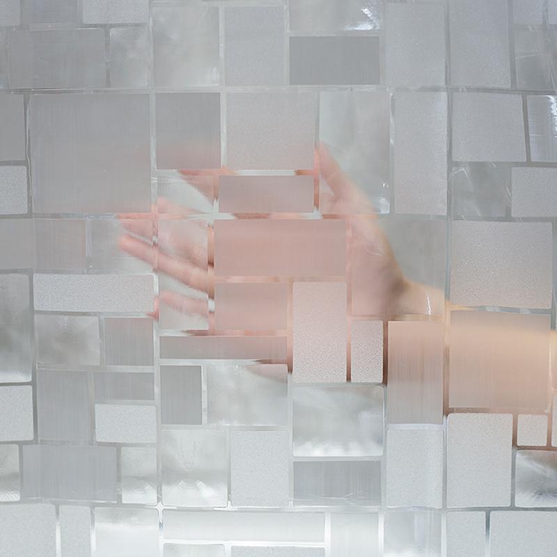 Daylight passing through the clear panel and its silver square print