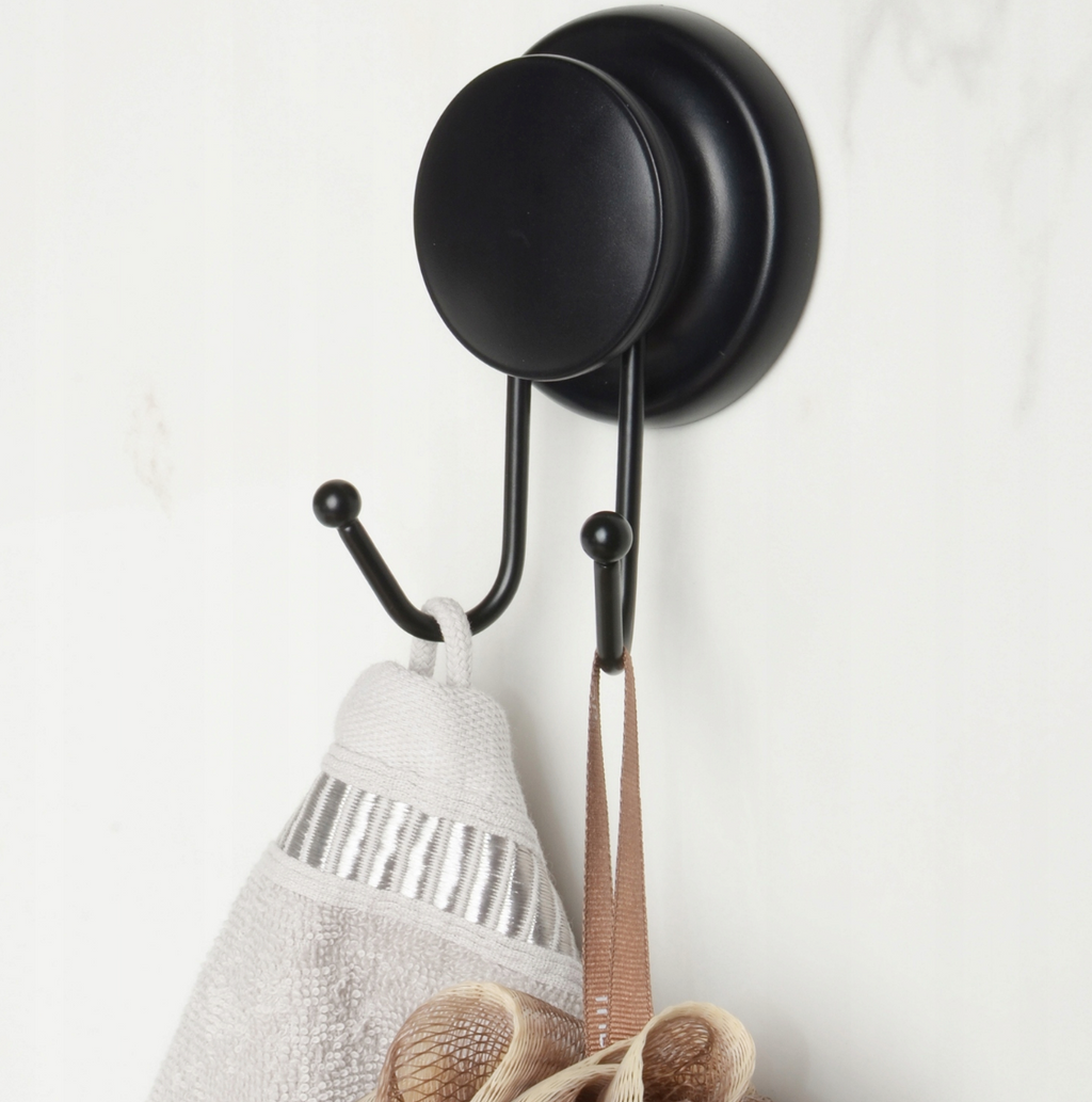 Compact black double hook styled in a small modern bathroom