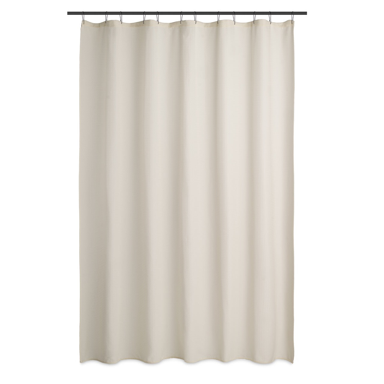 Cream waffle curtain styled in a bright bathroom with pale tiling