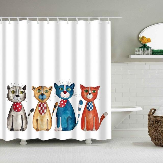 Four watercolour cats in spotted and checked bibs lined up on white