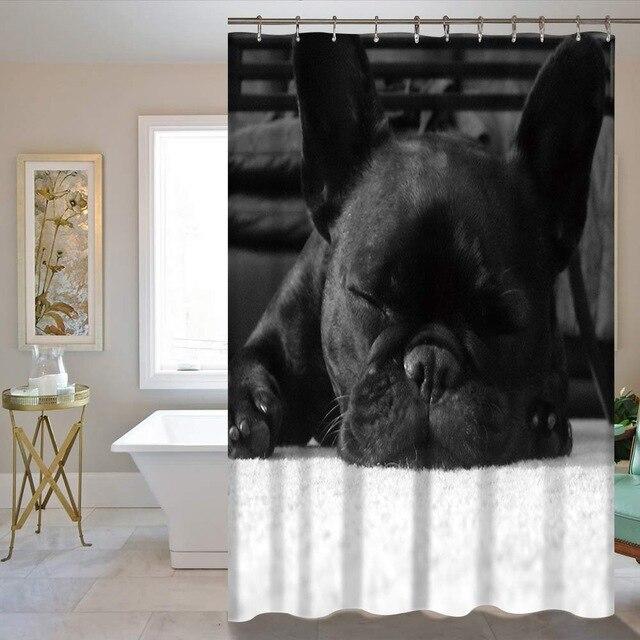 Black French bulldog asleep with its muzzle resting on its paws
