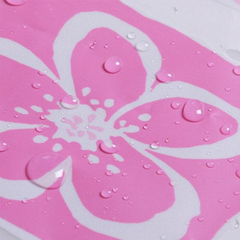 Close view of the small pink flowers inside the check squares