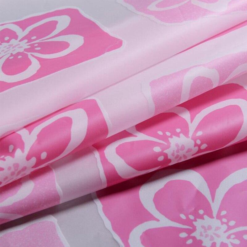 Full drop of the pink check panel hanging in soft folds