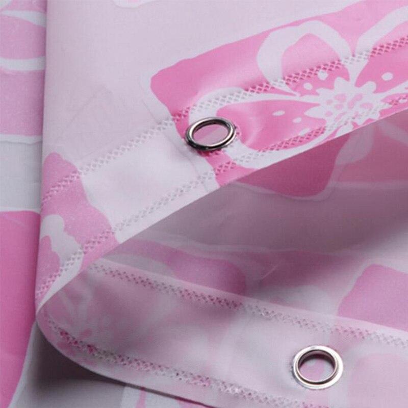 Pink and white check curtain hung across a shower opening
