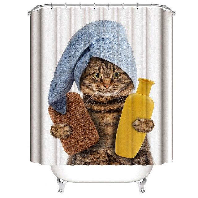 Close view of the cat face under its rolled blue bath towel