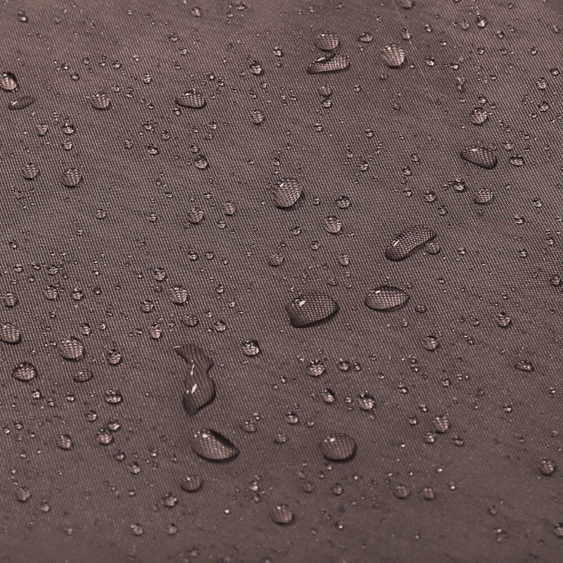 Metal eyelets along the top hem of the dark brown curtain panel