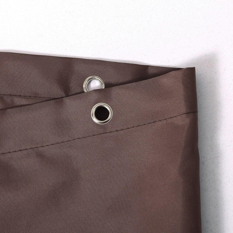 Dark brown curtain styled in a warm neutral bathroom in daylight