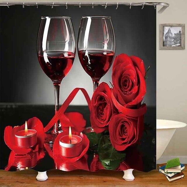 Open red roses and scattered petals glowing against a deep black ground
