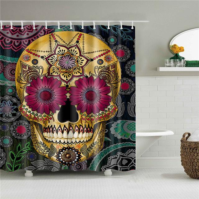 Gold skull with fuchsia daisy eyes on a dark green paisley and medallion print