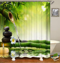 Deep green bamboo with a fountain stacked black pebbles and white frangipani