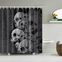 Mid grey skulls stacked across a very dark charcoal desaturated background