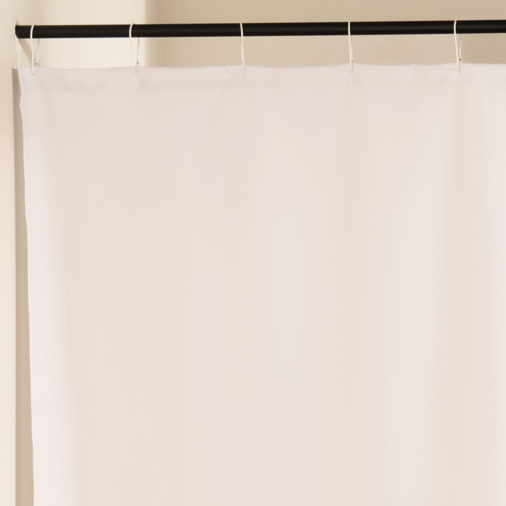 Close detail of the dense parallel black lines on the cream cloth