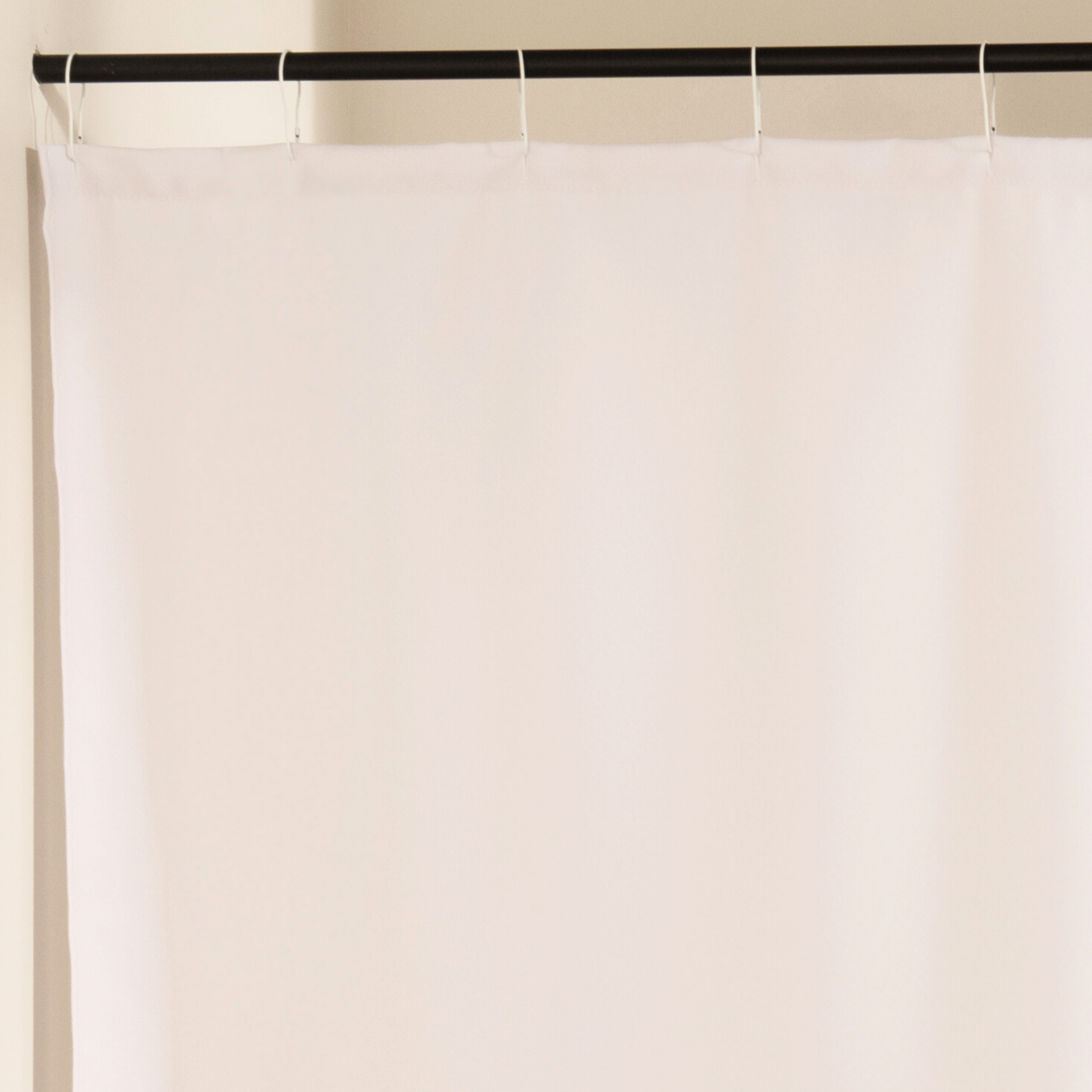 Close detail of the dense parallel black lines on the cream cloth