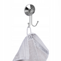 Brushed silver double towel hook mounted on a smooth tiled wall