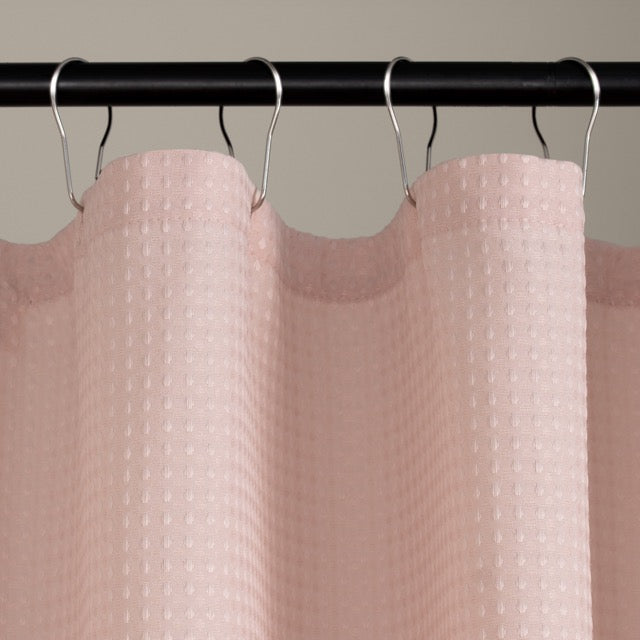 Macro view of the waffle relief across the dusty rose weave