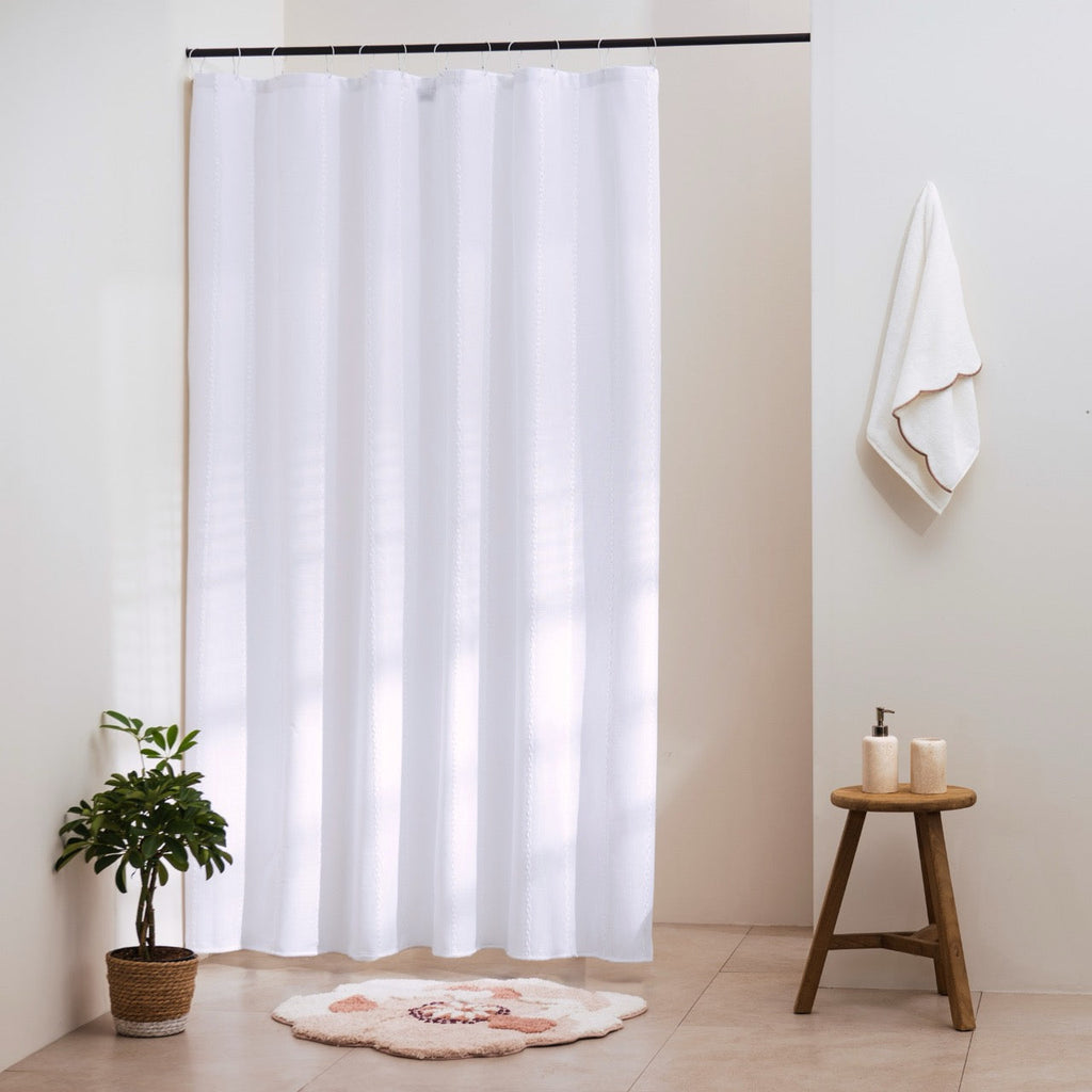 Plain white curtain panel with fine vertical ribs in a soft heavy fall