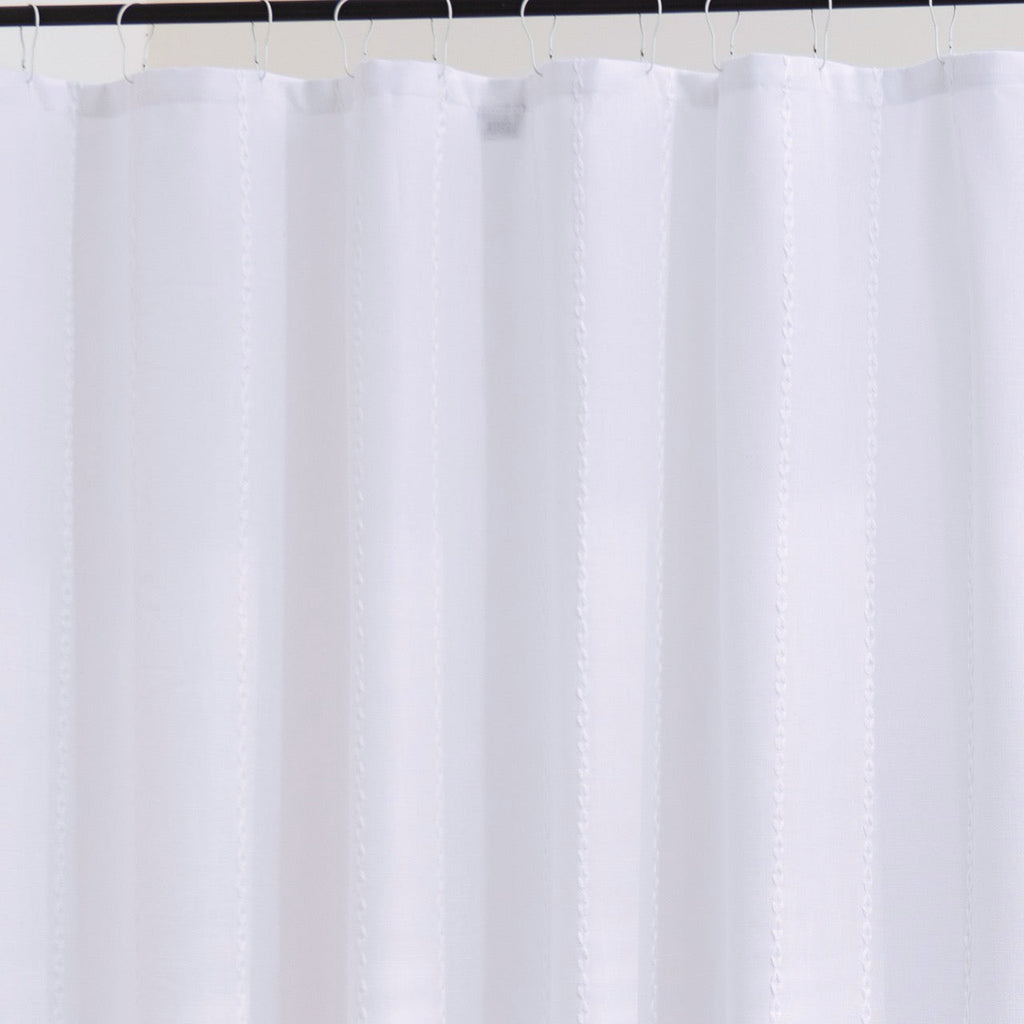 Close detail of the ribbed white weave catching soft daylight