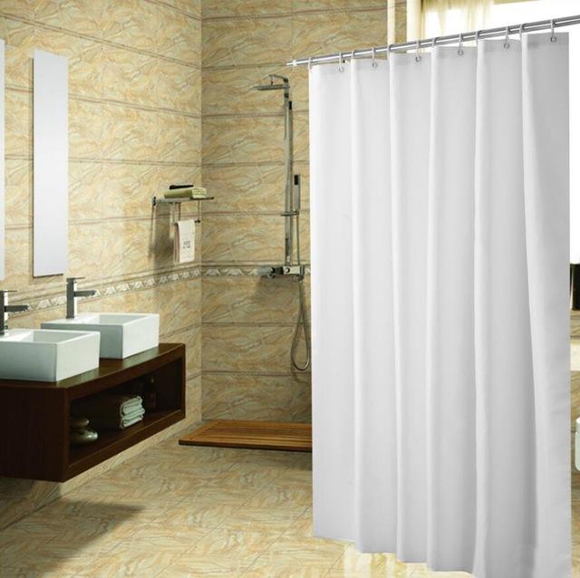 Plain matte white fabric panel with a clean hem and metal top eyelets