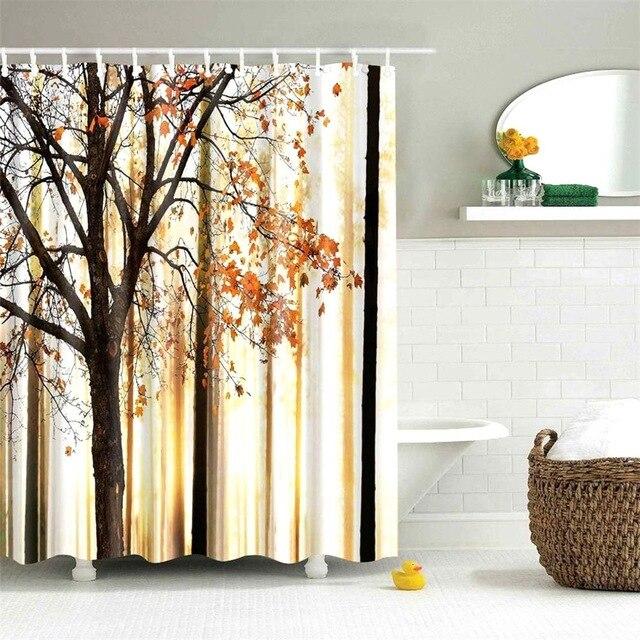 Autumn woodland with orange and ochre foliage on dark trunks in golden light