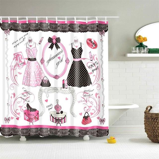 Illustrated dresses bags lipstick and perfume framed by black lace borders in pink