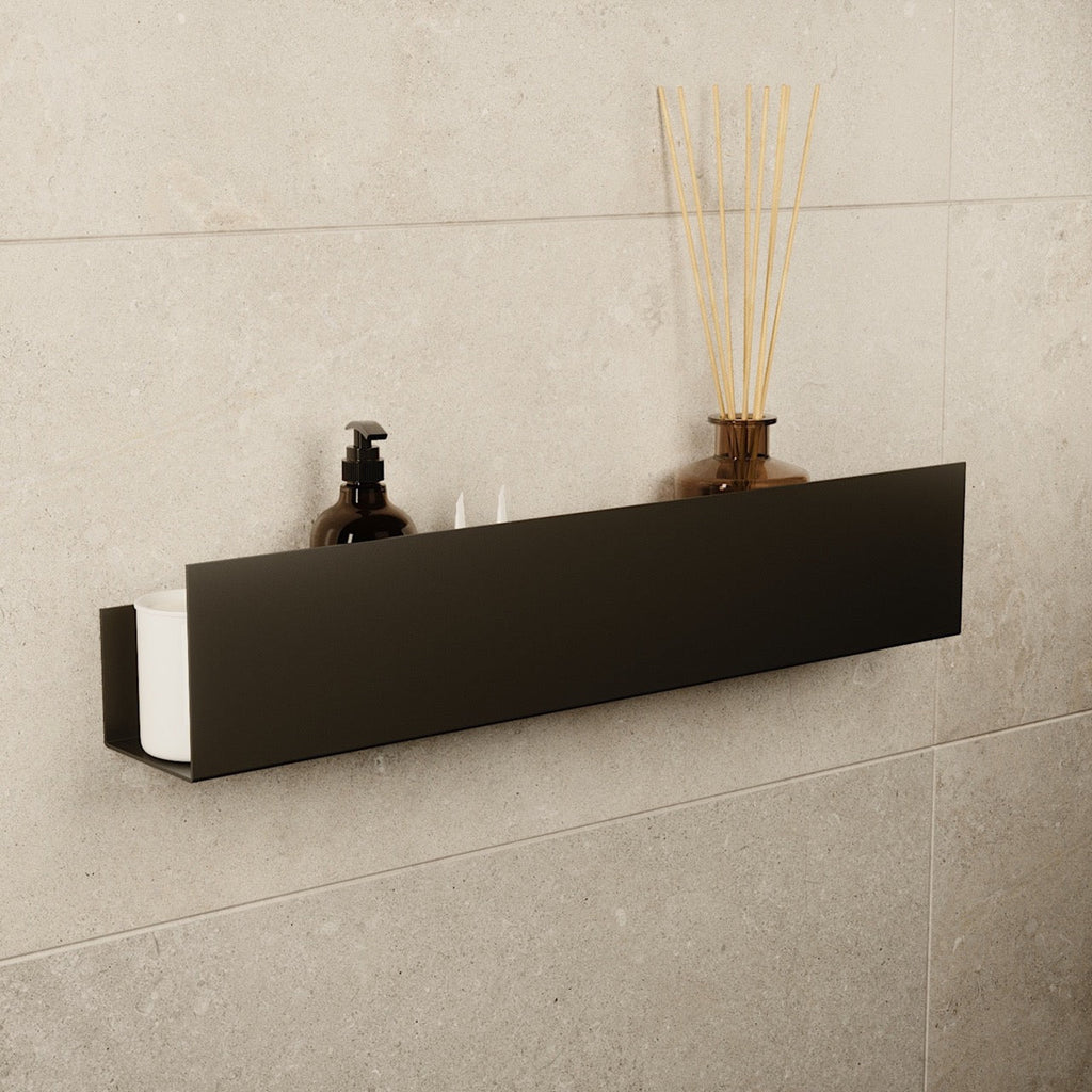 Large black stainless steel floating shelf mounted on a tiled wall