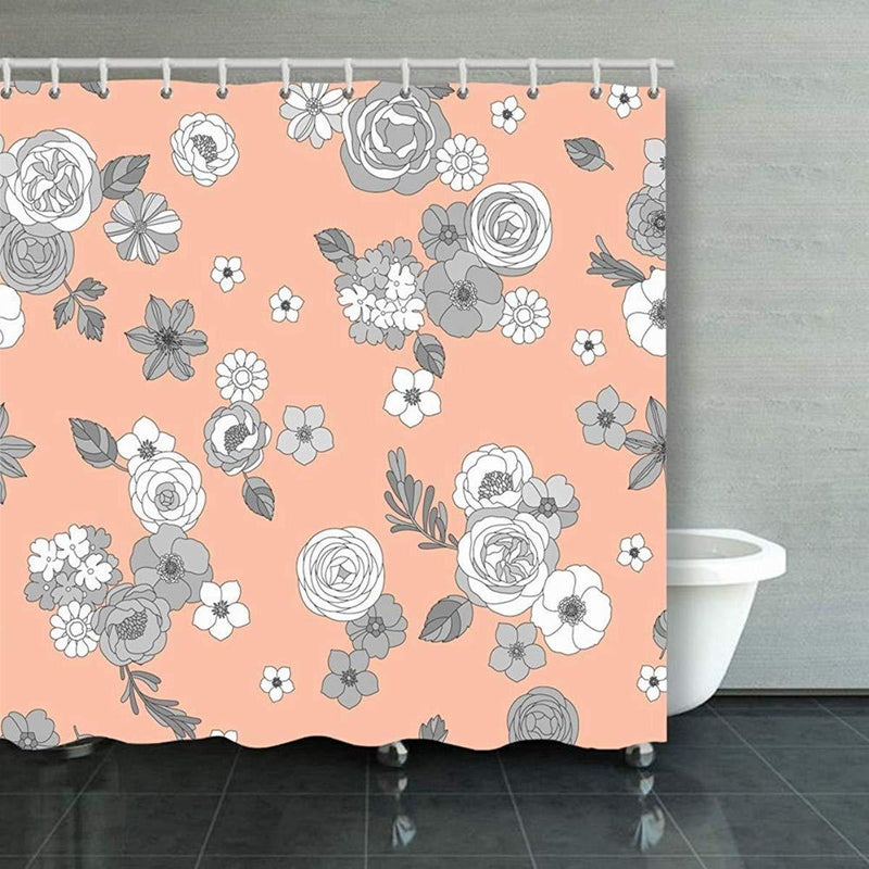 Grey and white drawn flowers scattered over a peach coloured textile ground