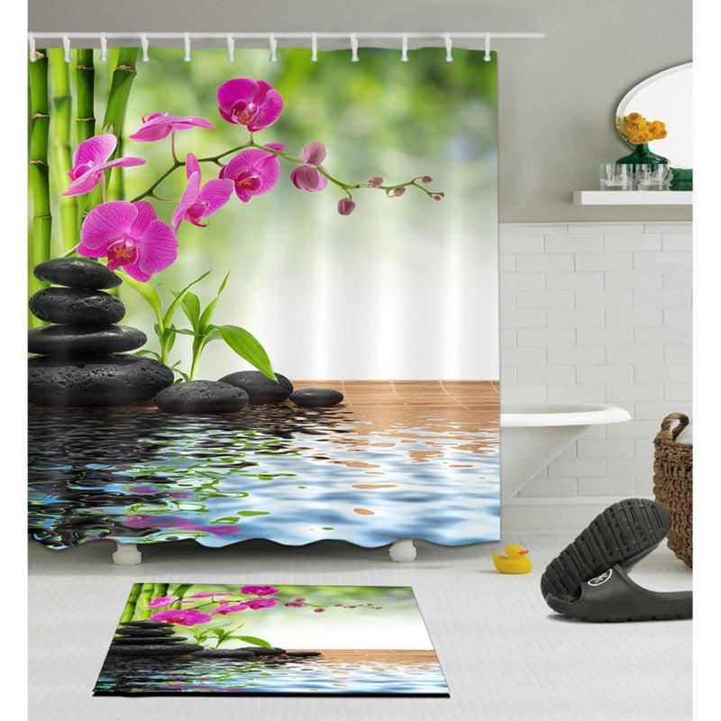 Fuchsia orchid branch printed above black pebbles and green bamboo stems