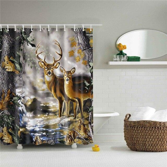 Two deer standing beside a stream in autumn woodland filled with warm foliage