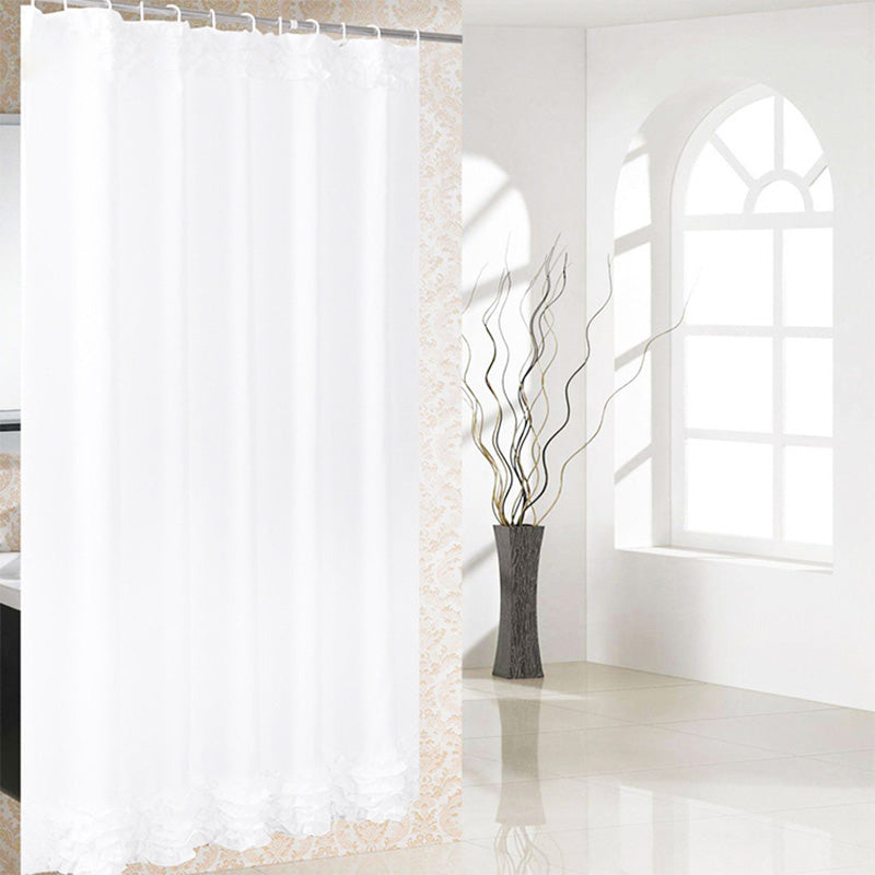 Plain white panel edged with a gathered lace band forming a soft frill