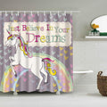 Rainbow-maned unicorn rearing on a pastel arc over a grey heart-strewn ground