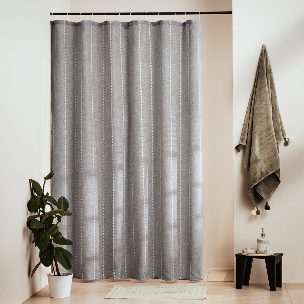 Mid grey fabric with fine vertical striae and a visible textile grain