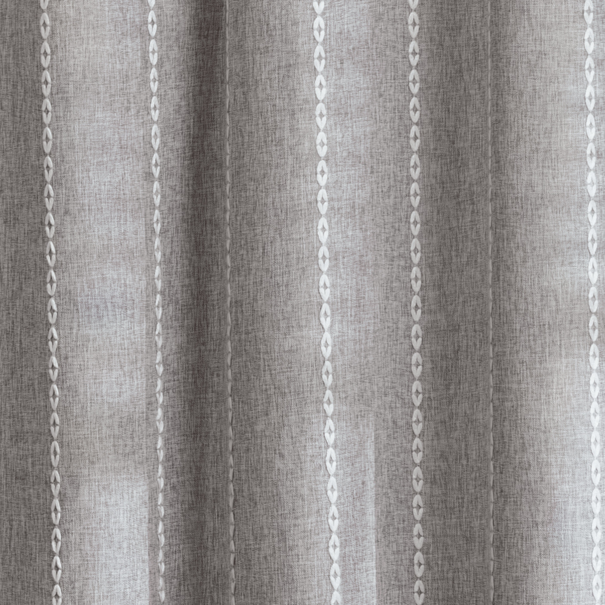 Weighted lower hem keeping the grey panel hanging evenly straight