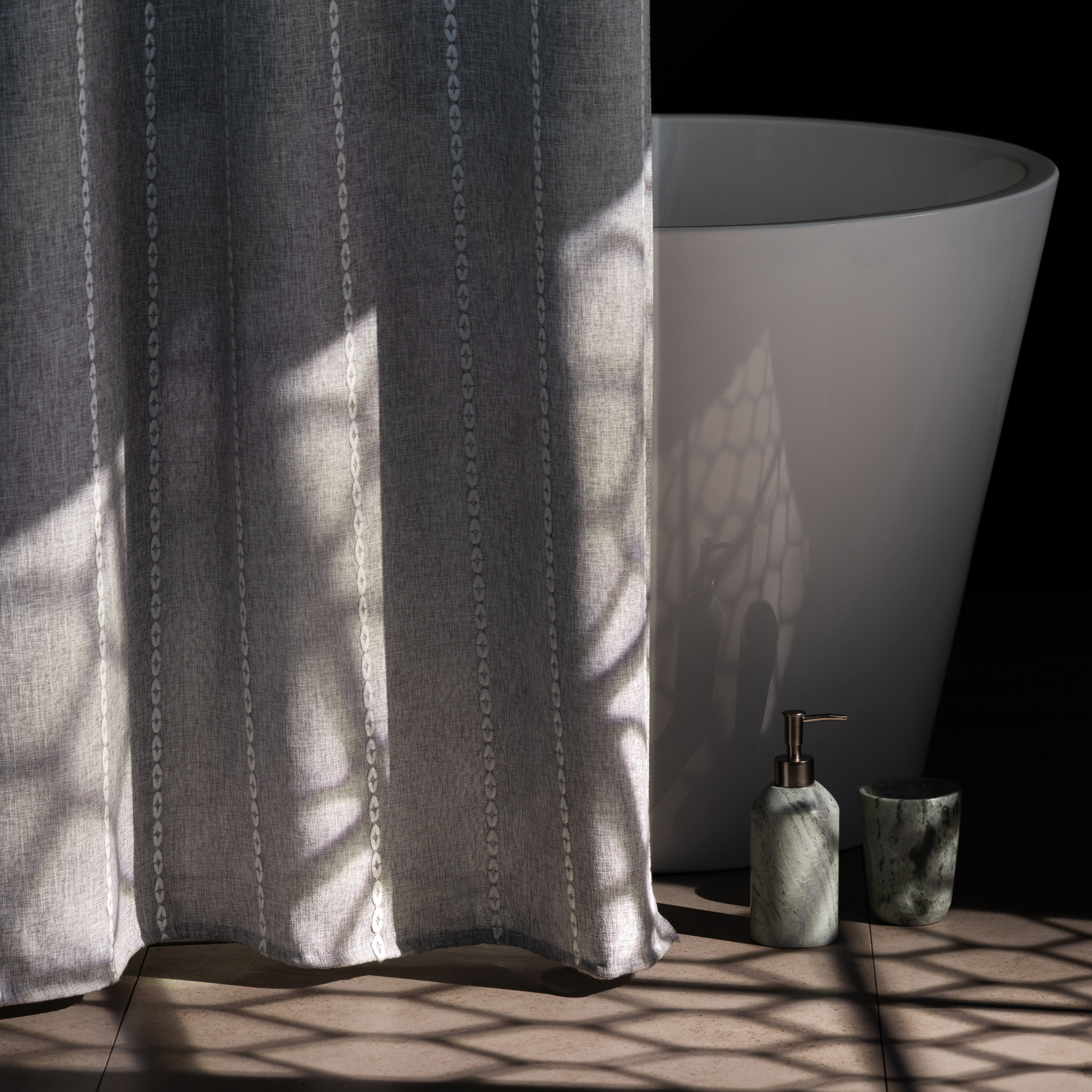 Side view of the grey panel showing its soft heavy textile drape