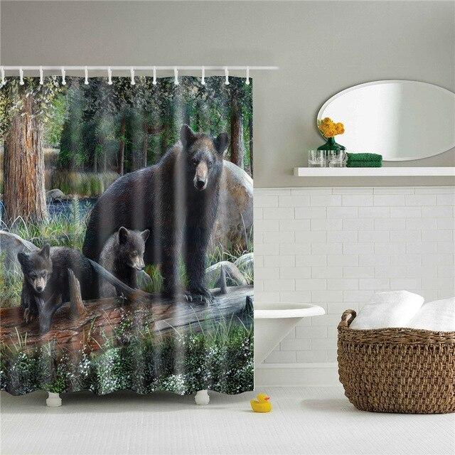 Dark brown bear in front of dense green woodland and shadowed tree trunks