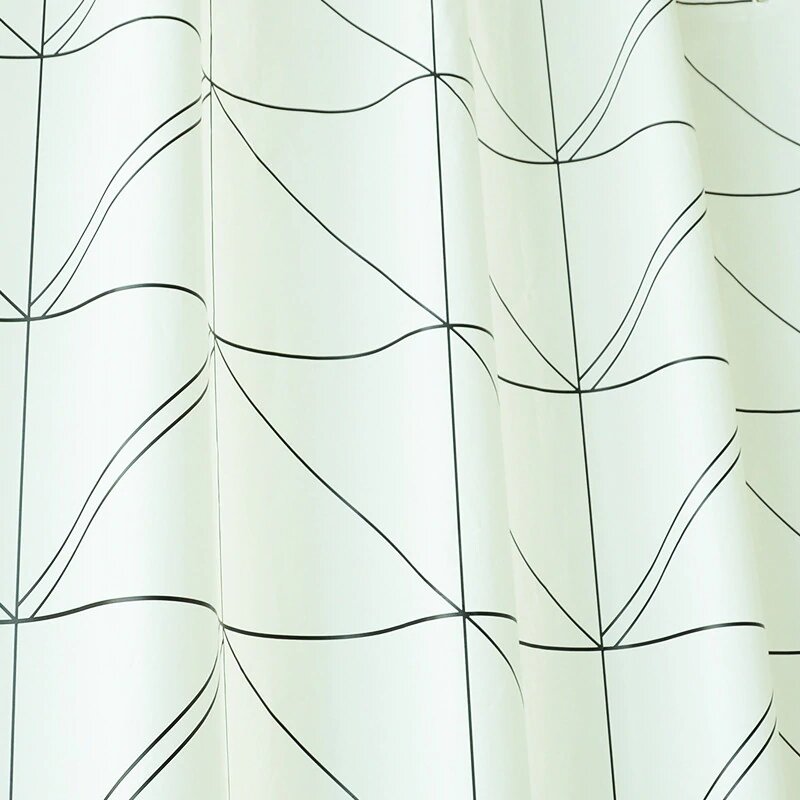 Close view of the diamond line weave on green fabric