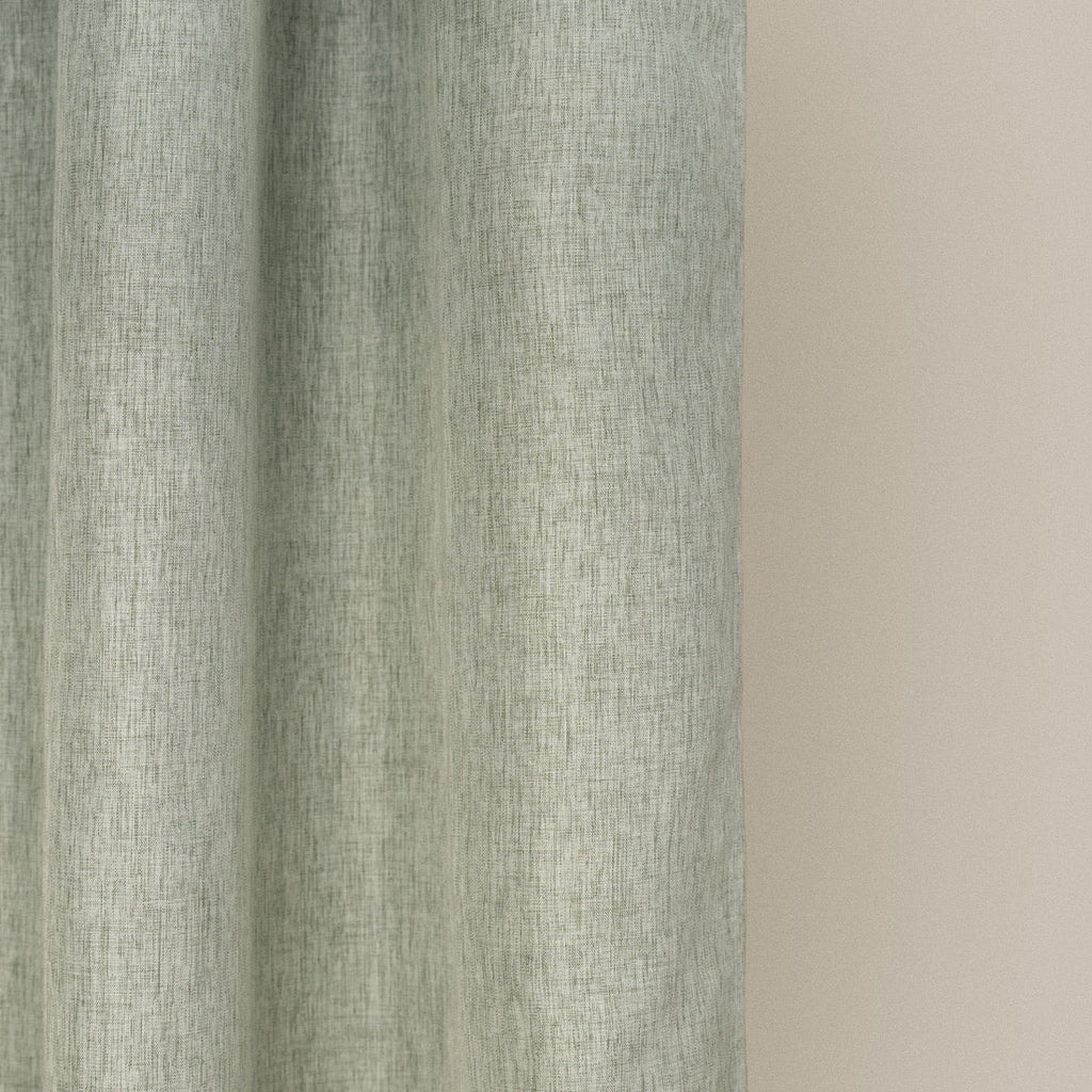 Weighted lower hem holding the sage panel in a straight even fall