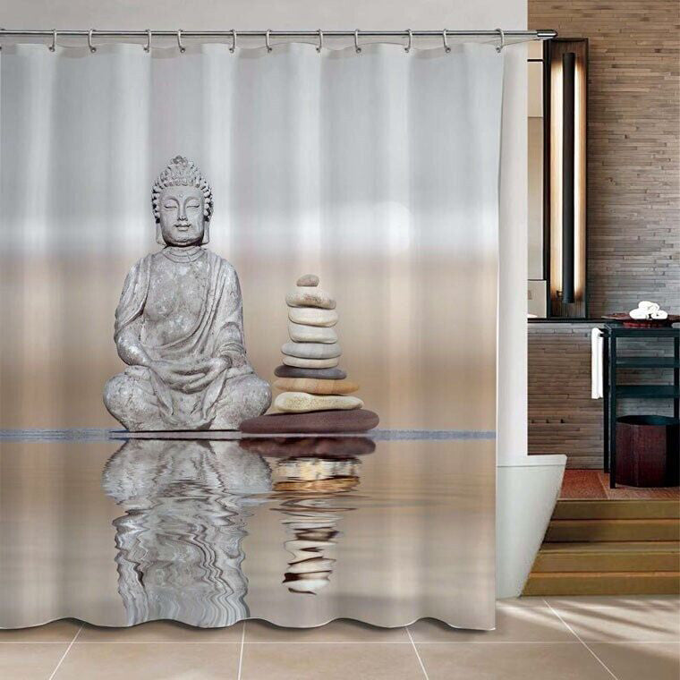 Stone Buddha with stacked grey pebbles reflected in still water