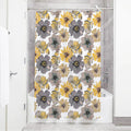 Large open anemones in slate and taupe grey with mustard blooms on white