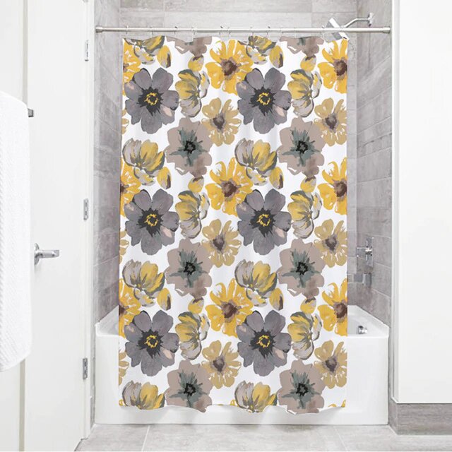Large open anemones in slate and taupe grey with mustard blooms on white