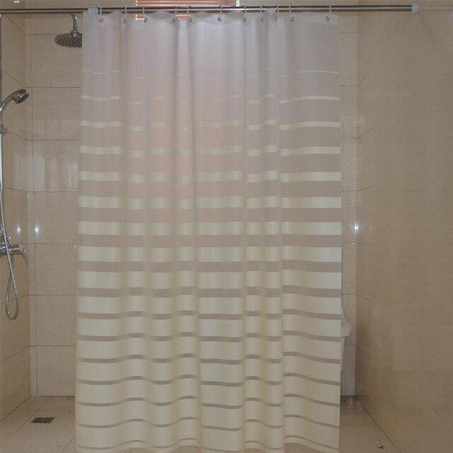 Full length striped curtain hanging straight along a white bathtub