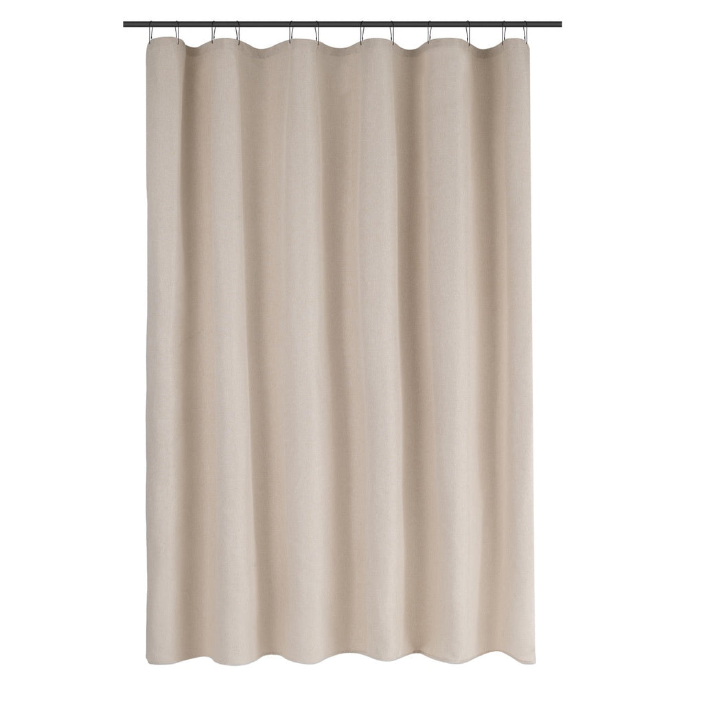 Ivory linen look curtain styled beside a bathtub in warm daylight