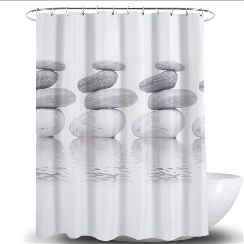 Close view of the smooth stacked stones on a white gradient