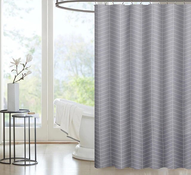 Tightly woven light grey and white chevrons falling in soft folds