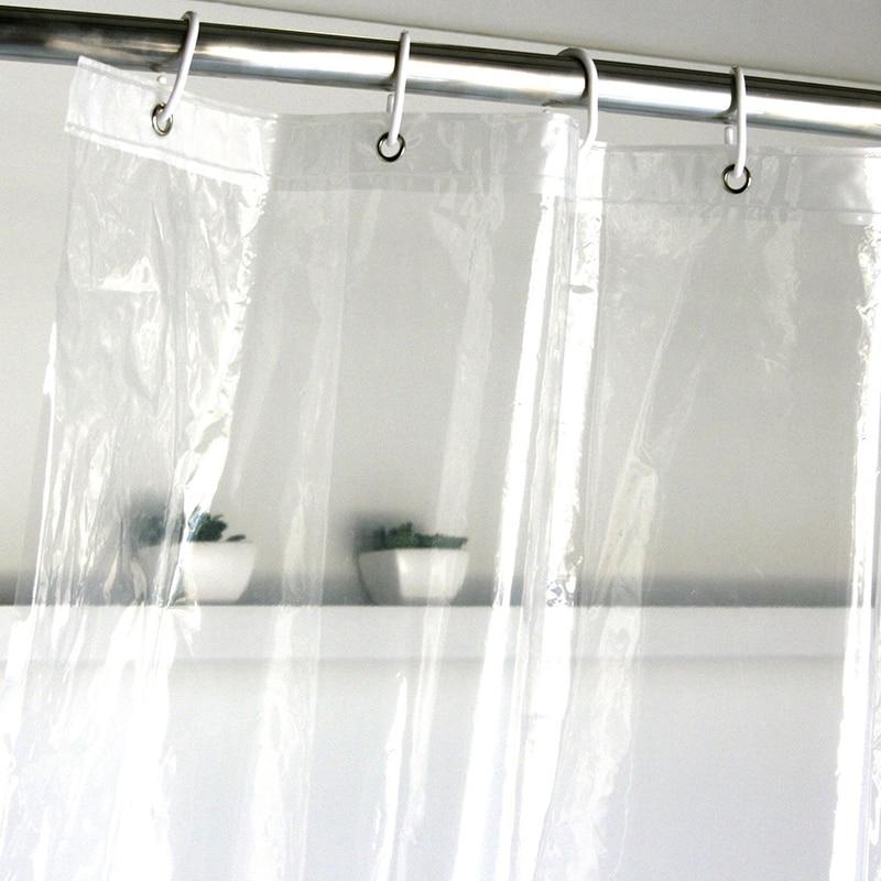 Clear lightweight curtain hanging along a bath in a bright room