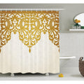 Gold arabesque crown arching across an ivory tone on tone damask ground