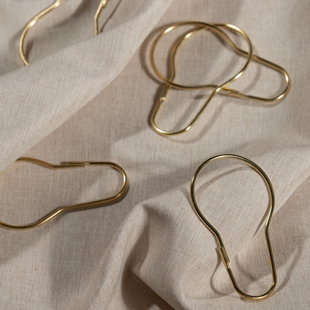 Close view of the polished gold finish on a pear shaped ring
