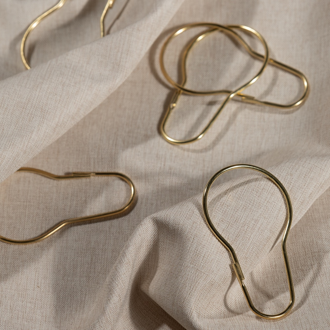 Close view of the polished gold finish on a pear shaped ring