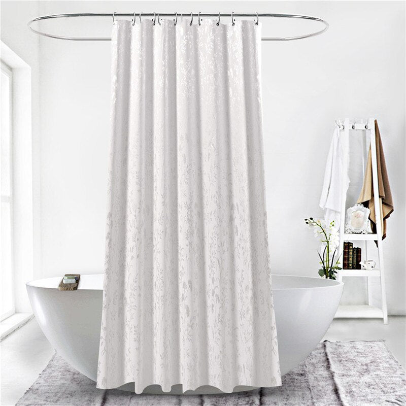 Full length white matelasse curtain hanging in even textile folds
